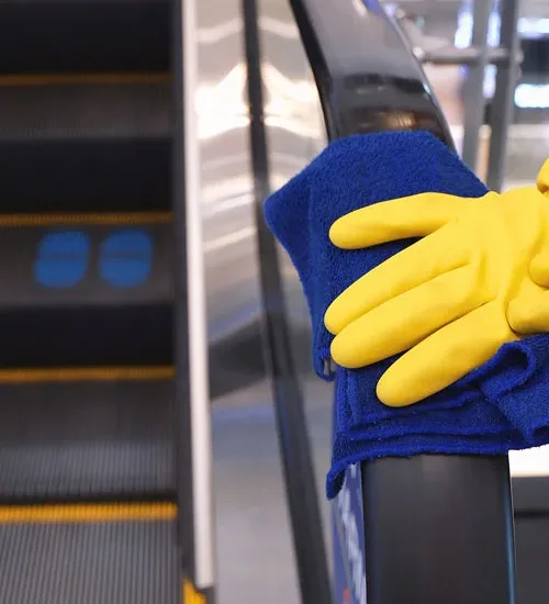 Wiping a shopping-center handrail